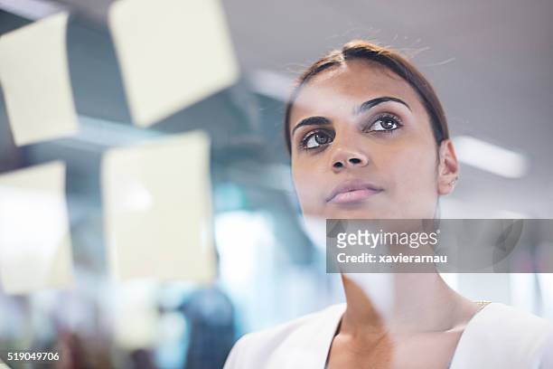 aboriginal woman thinking about new ideas - minority groups stock pictures, royalty-free photos & images