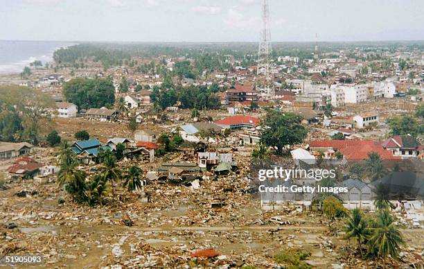 In this handout photo taken from a print via the Indonesian Air Force, the scene of devastation in Meulaboh, the town closest to the Sunday's...