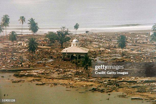 In this handout photo taken from a print via the Indonesian Air Force, the scene of devastation in Meulaboh, the town closest to the Sunday's...