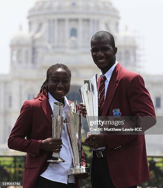 Stafanie Taylor, Captain of the West Indies and Darren Sammy, Captain of the West Indies pose with the trophies during a photocall after winning the...