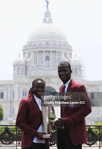 Stafanie Taylor, Captain of the West Indies and Darren Sammy, Captain of the West Indies pose with the trophies during a photocall after winning the...