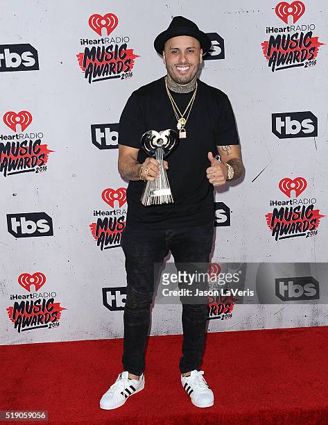 Singer Nicky Jam poses in the press room at the iHeartRadio Music Awards at The Forum on April 3, 2016 in Inglewood, California.