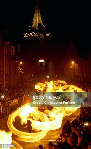 Hogmanay fireball swingers illuminate the streets of Stonehaven carrying on the tradition of welcoming the new year January 1 Stonehaven, Scotland....