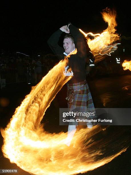 Hogmanay fireball swingers illuminate the streets of Stonehaven carrying on the tradition of welcoming the new year January 1 Stonehaven, Scotland....