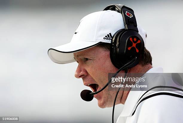 Head coach Bobby Petrino of the Louisville Cardinals coaches his team against the Boise State Broncos during the AutoZone Liberty Bowl on December...