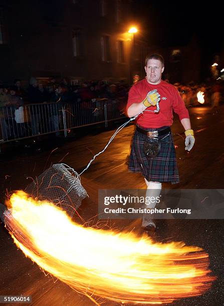 Hogmanay fireball swingers illuminate the streets of Stonehaven carrying on the tradition of welcoming the new year January 1 Stonehaven, Scotland....