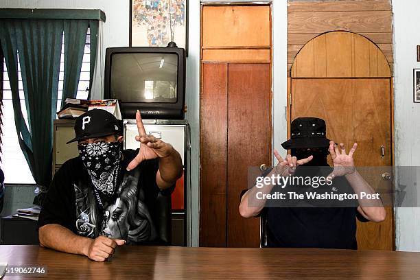 The spokesmen for the 18th Street gang Revolucionarios and MS-13 sit for an interview with The Washington Post via Getty Images.