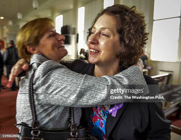 Sharon Goetz, right, whose son was helped by the Wounded Warrior Regiment, greets a mourner after a memorial service for Crystal Hamilton, killed...