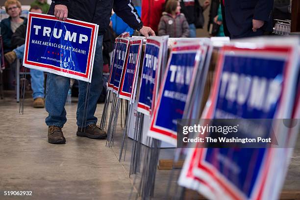 Signs for republican presidential candidate Donald Trump are seen before former Alaska Gov. Sarah Palin speaks as she campaigns for Donald Trump at...