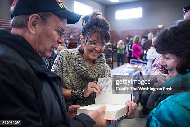 Former Alaska Gov. Sarah Palin greets people as she campaigns for republican presidential candidate Donald Trump at Zingers & Flingers indoor...