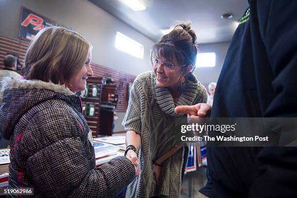 Former Alaska Gov. Sarah Palin greets people as she campaigns for republican presidential candidate Donald Trump at Zingers & Flingers indoor...