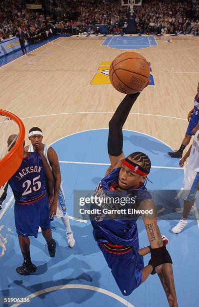 Allen Iverson of the Philadelphia 76ers goes to the basket against the Denver Nuggets December 31, 2004 at Pepsi Center in Denver, Colorado. NOTE TO...