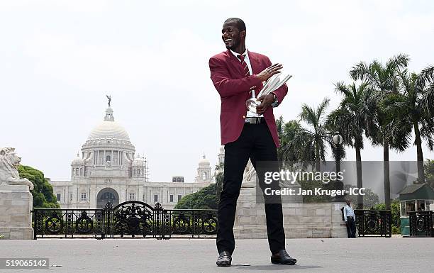 Darren Sammy, Captain of the West Indies poses with the trophy during a photocall after winning the Final of the ICC Men's World Twenty20 at the...