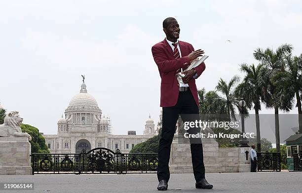 Darren Sammy, Captain of the West Indies poses with the trophy during a photocall after winning the Final of the ICC Men's World Twenty20 at the...