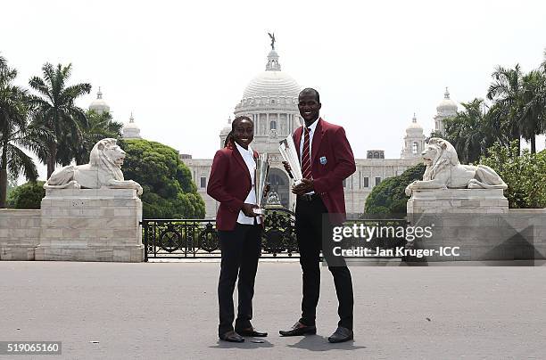 Stafanie Taylor, Captain of the West Indies and Darren Sammy, Captain of the West Indies pos with the trophies during a photocall after winning the...