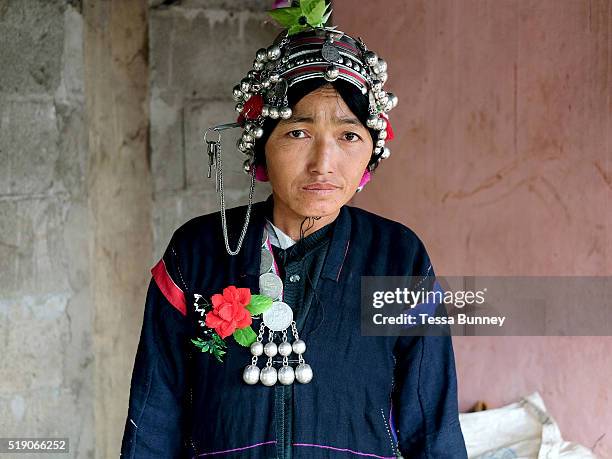 An Akha woman dressed in traditional clothing made from handspun indigo dyed cotton at a wedding in Ban Lang Pa village, Luang Namtha province, Lao...