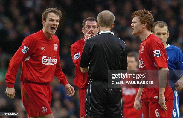 Liverpool's Dietmar Hamann, Jamie Carragher and John Arne Riise remonstrate with referee Mike Riley after a missed handball by Chelsea during their...