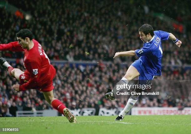Joe Cole of Chelsea shoots past Antonio Nunez of Liverpool during the Barclays Premiership match between Liverpool and Chelsea at Anfield on January...