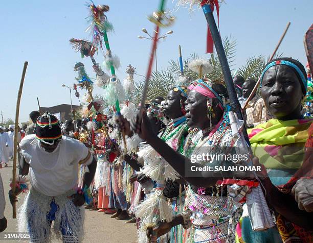 Sudanese folkloric troupe perform a traditional dance during celebrations at the headquarters of the ruling National Congress party in Khartoum 01...
