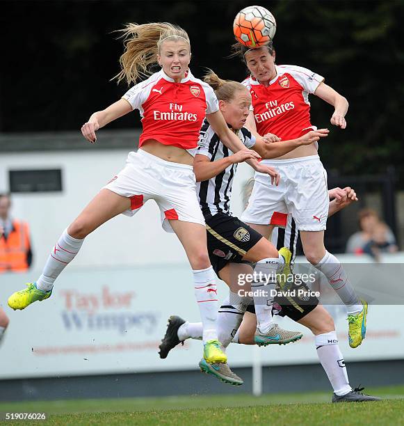 Leah Williamson and Natalia Pablos Sanchon of Arsenal Ladies jump for the ball with Danielle Buet of Notts County Ladies during the match between...