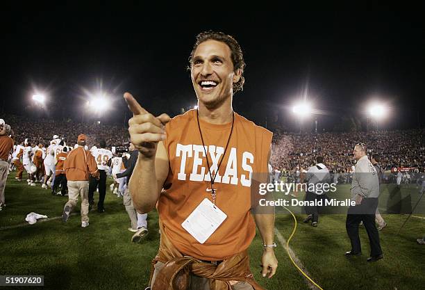 Actor Matthew McConaughey celebrates on the field after the Texas Longhorns defeated the Michigan Wolverines in the 91st Rose Bowl Game at the Rose...