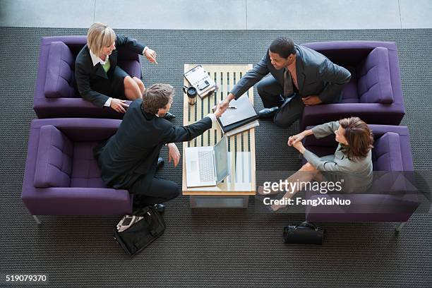 businesspeople making introductions - bonding stock pictures, royalty-free photos & images