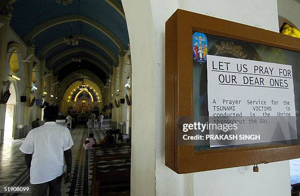 Indian devotees arrive for a special prayer meeting for tsunami victims at the Basilica Shrine in Velankanni 365 kms south of Madras, 02 January...