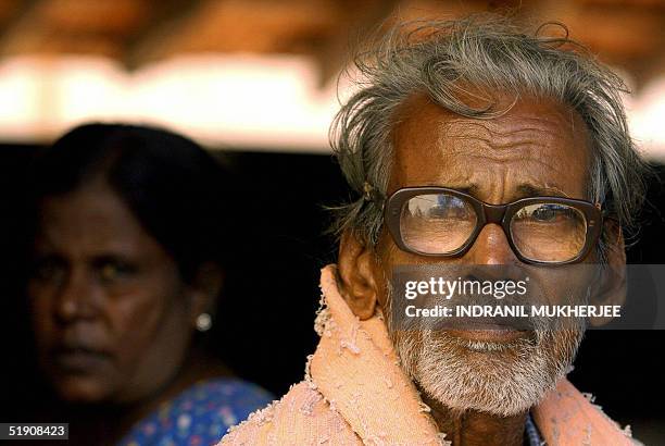 Homeless Sri Lankan elderly tsunami victim waits for news of his missing family members at the Vada Hindu Maha Vidyala in Vadamarachi near Point...