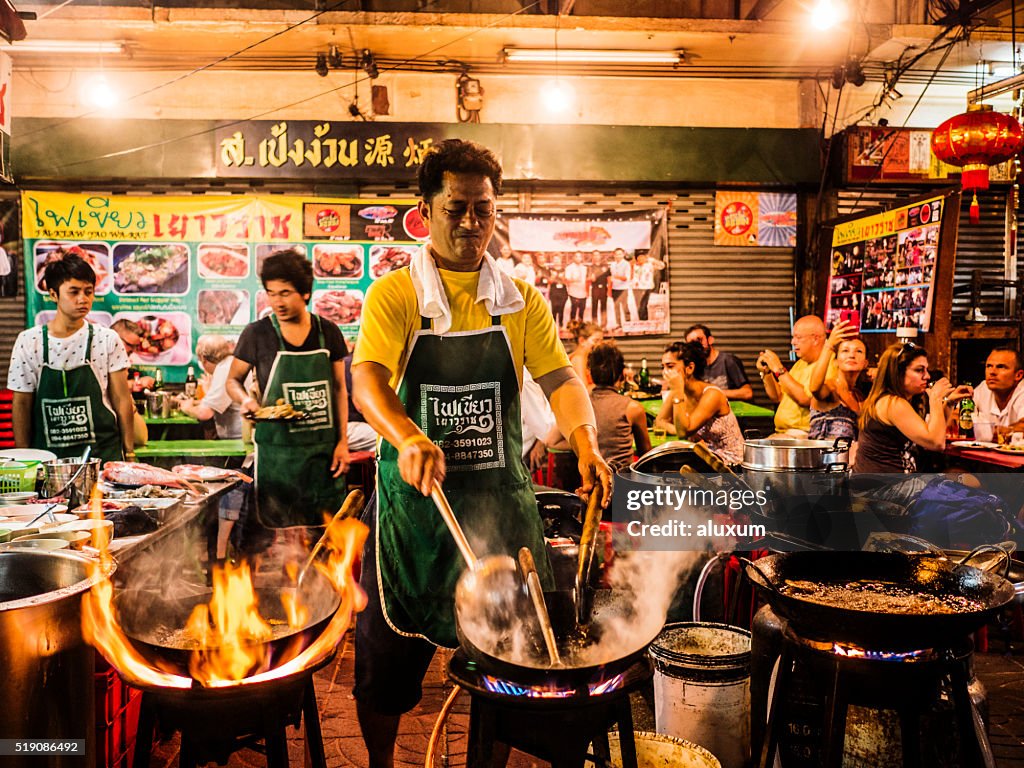 Cooking food in the street Chinatown Bangkok Thailand