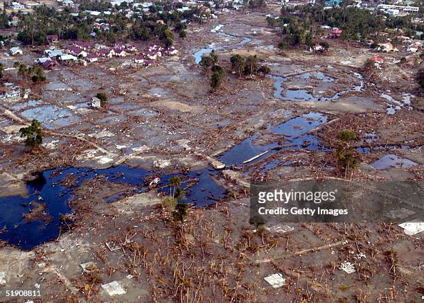 In this handout photo from the U.S. Navy, a view of the landscape after the tsunami swept through over Banda Aceh on January 1, 2005 in Sumatra,...