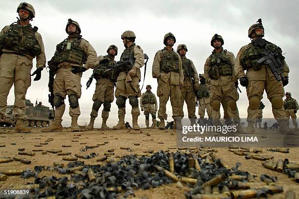 Troops watch their armored vehicles firing in a desert area on the outskirts of the northern restive city of Mosul, 370km of Baghdad, 02 January...