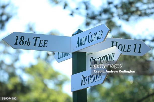 Signage indicates directions to areas such as Amen Corner during a practice round prior to the start of the 2016 Masters Tournament at Augusta...