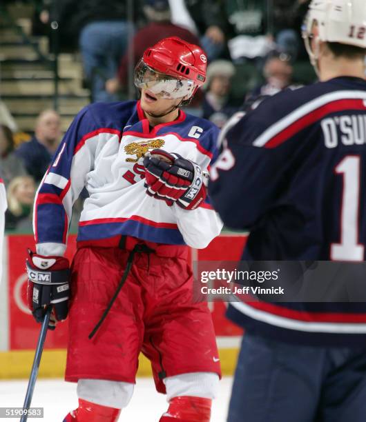 Forward Patrick O'Sullivan of Team USA looks on as forward Alexander Ovechkin of Russia taunts the pro-USA crowd after scoring an empty net goal...