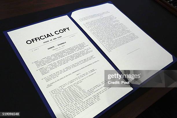 The official copy of New York State's $15 minimum wage bill is displayed at the Jacob Javits Center, April 4, 2016 in New York City. Gov. Andrew...