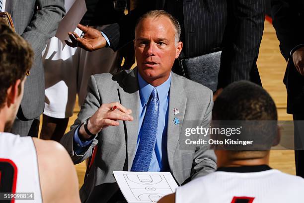 Head Coach Dean Cooper of the Idaho Stampede talks to his players during a time out against the Santa Cruz Warriors at CenturyLink Arena on April 2,...