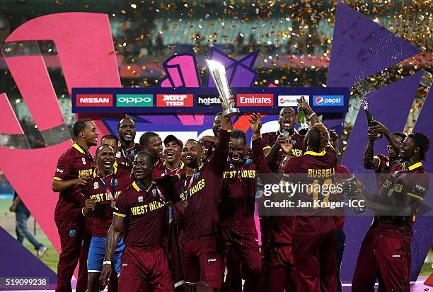 Darren Sammy, Captain of the West Indies and his team celebrate with the trophy during the ICC World Twenty20 India 2016 final match between England...