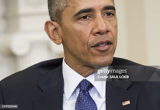 President Barack Obama speaks during a meeting with NATO Secretary General Jens Stoltenberg in the Oval Office of the White House in Washington, DC,...