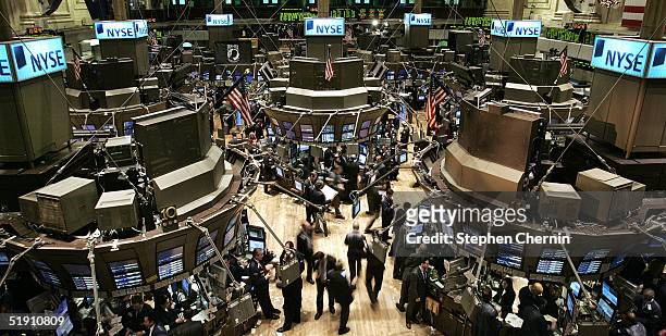 Traders work on the floor of the New York Stock Exchange during the first day of trading in the new year January 3, 2005 in New York City. Despite...