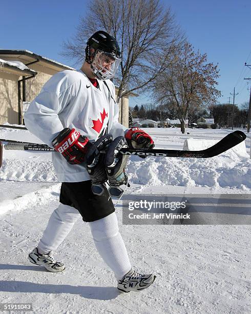 Sidney Crosby carries his skates as he leaves the Gambucci Arena after a Team Canada practice at the World Junior Hockey Championships January 3,...