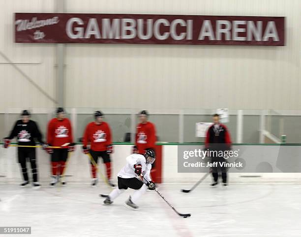 Sidney Crosby skates by teammates as he does a drill during a Team Canada practice at the World Junior Hockey Championships at the Gambucci Arena...