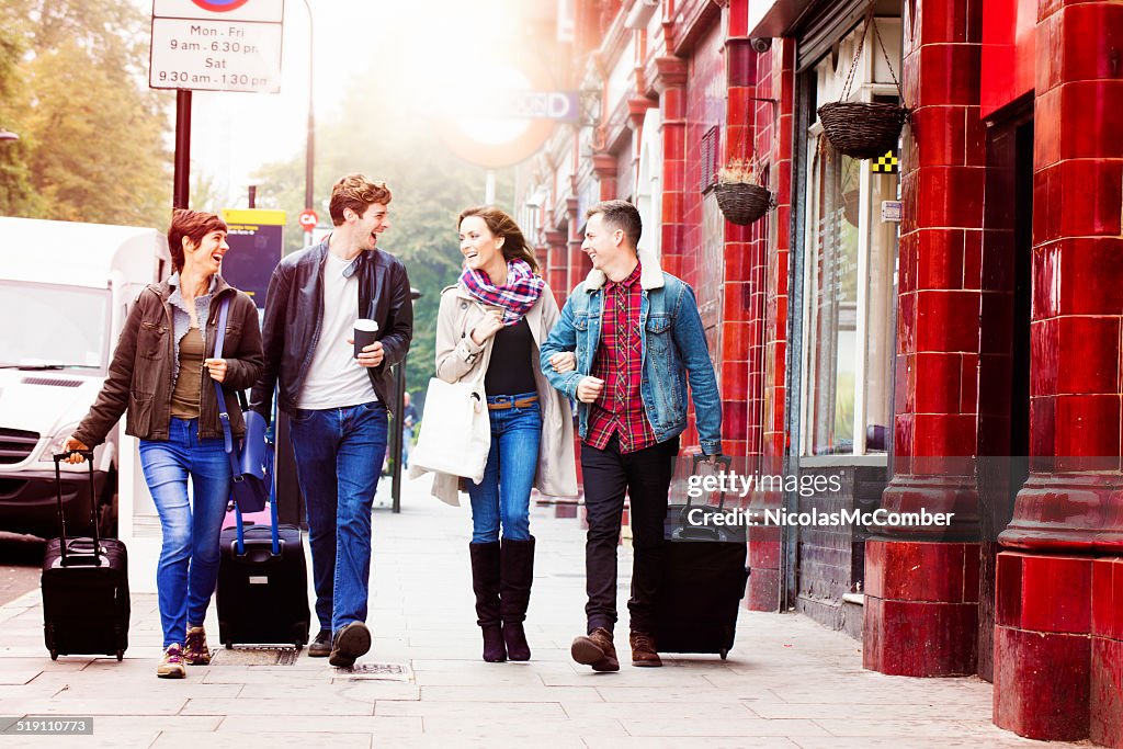 Four friends arriving in London