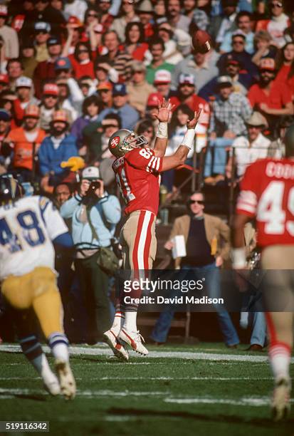 Russ Francis of the San Francisco 49ers attempts to catch a pass from quarterback Joe Montana during a National Football League game against the San...