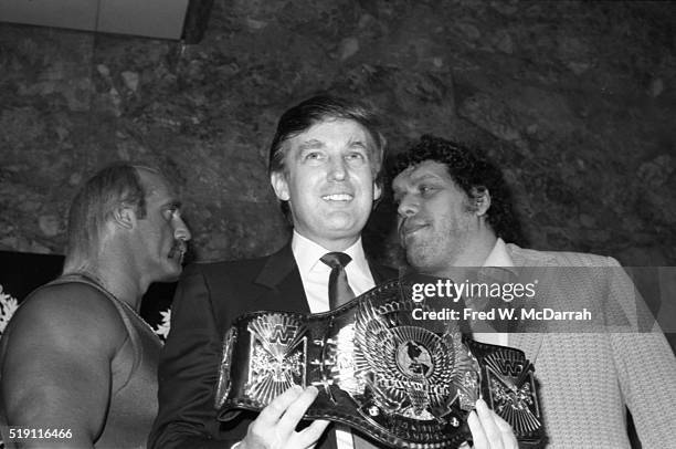 During a Wrestlemania event at the Trump Plaza, American businessman Donald Trump poses with wrestlers Hulk Hogan and Andre the Giant , Atlantic...