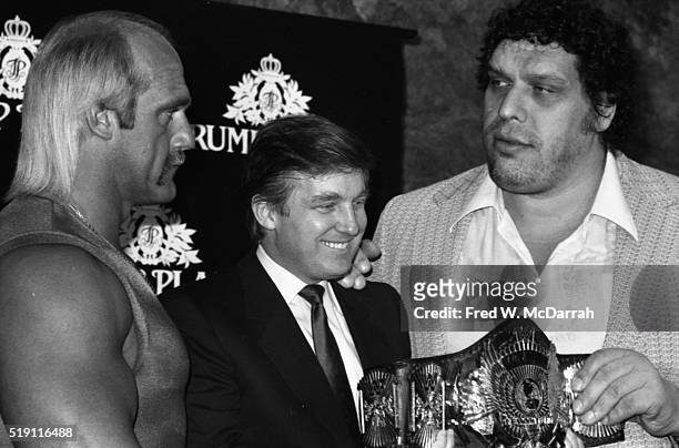 During a Wrestlemania event at the Trump Plaza, American businessman Donald Trump poses with wrestlers Hulk Hogan and Andre the Giant , Atlantic...