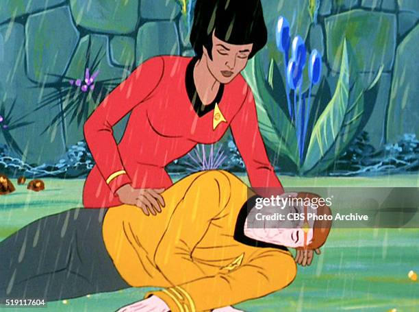 Uhura rescues a weakened Captain Kirk in Star Trek: The Animated Series episode, "The Lorelei Signal." Original air date, September 29, 1973. Image...