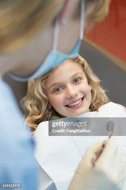 dentist and patient - baby bib stock pictures, royalty-free photos & images