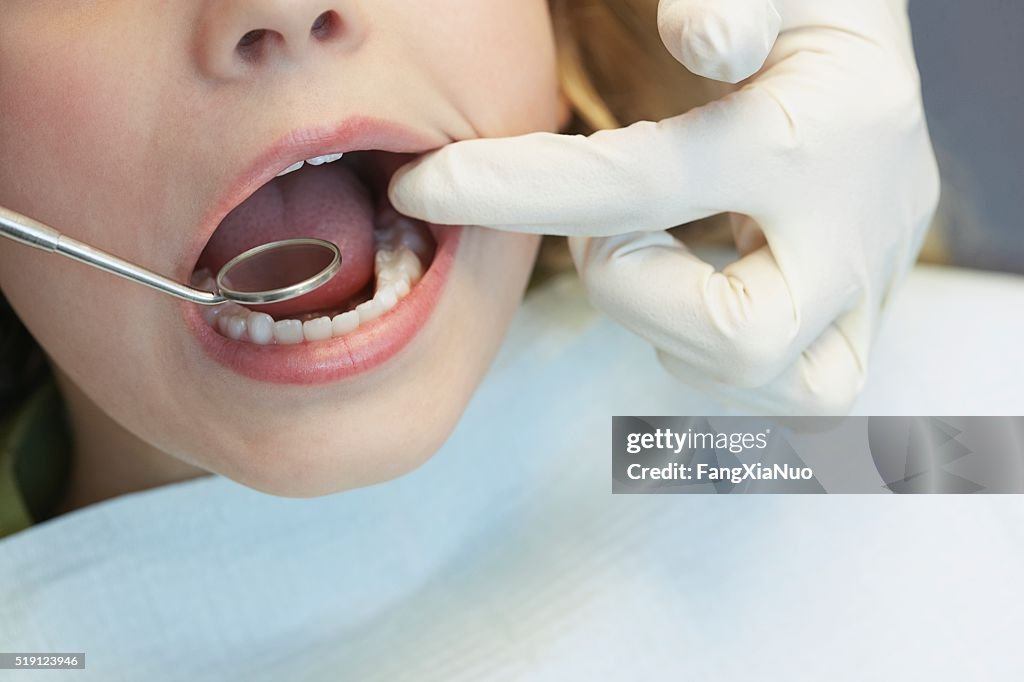 Child having a dental examination