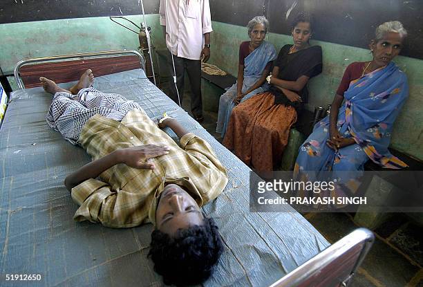 Indian child Sarwana undergoes treatment as his relatives sit nearby at a local hospital in a village near Velankanni, some 390 kms south of Madras,...