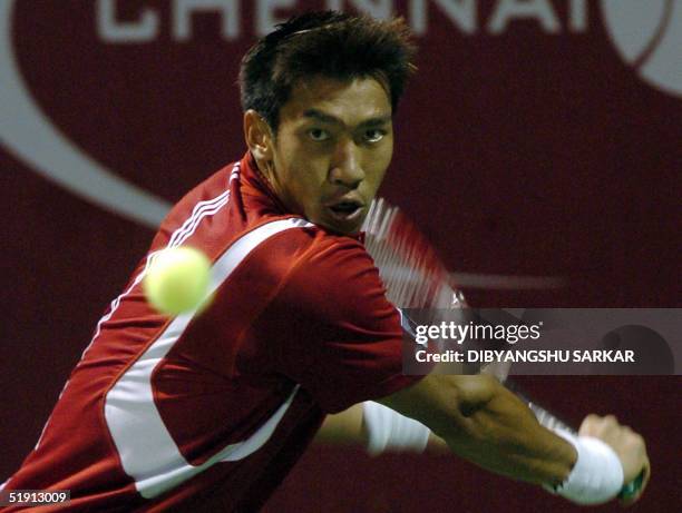 Thailand's Paradorn Srichaphan hits the ball during his first round match against Belgian Christophe Rochus during the Chennai Open Tennis...