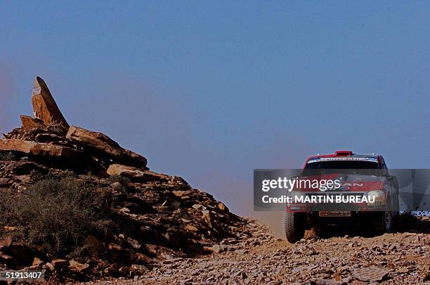 British Colin Mc Rae drives his Nissan 04 January 2005 during the fifth stage of the 27th Dakar Rally between Agadir and Smara. McRae, driving a...